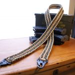 Two point paracord rifle sling. Primary color woodland camo. Secondary color tan. Double cobra weave. HK hooks.