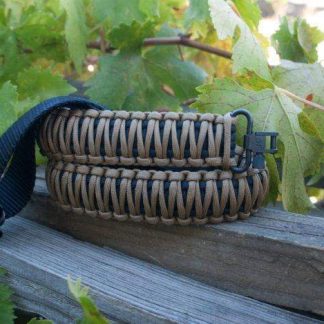 Two point paracord gun sling. Primary color coyote brown. Secondary color black. King cobra weave. GrovTec quick disconnect swivels.