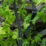 Convertible single point paracord rifle sling. Primary color black. Secondary color od green. Double cobra weave. HK hooks.