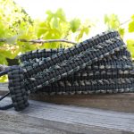 Fixed length paracord belt. Primary color OD green. Secondary color woodland camo. Double cobra weave. Black buckle.