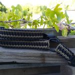 Convertible single point paracord gun sling. Primary color coyote brown. Secondary color black. Double cobra weave. HK hooks
