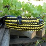 Tavor convertible single point paracord gun sling. Primary color black. Secondary color yellow. Double cobra weave. Push button quick release swivels.