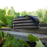 Two point paracord rifle sling. Primary color tan. Secondary color black. Extra wide double cobra weave. Push button quick release swivels.