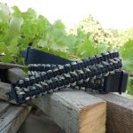 Two point paracord gun sling. Primary color black. Secondary color woodland camo. Double cobra weave. TOC quick disconnect swivels.