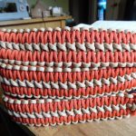 Two point paracord gun sling. Primary color solar orange. Secondary color tan. Extra wide double cobra weave. GrovTec quick disconnect swivels.