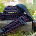 Convertible single point paracord rifle sling. Primary color burgundy. Secondary color black. Double cobra weave. Push button quick release swivels.