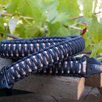 Two point paracord rifle sling. Primary color black. Secondary color tan. King cobra weave. HK hooks.