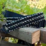 Two point paracord gun sling. Primary color black. Secondary color woodland camo. Double cobra weave. TOC quick disconnect swivels.