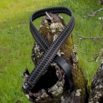 Two point paracord gun sling. Primary color grey. Secondary color black. Extra wide double cobra weave. Push button quick release swivels.