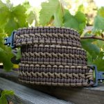 Two point paracord gun sling. Primary color brown. Secondary color coyote brown. Double cobra weave. TOC quick disconnect swivels.