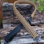 Two point paracord gun sling. Primary color coyote brown. Secondary color black. King cobra weave. TOC quick disconnect swivels.