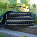 Two point paracord gun sling. Primary color coyote brown. Secondary color black. Double cobra weave. GrovTec quick disconnect swivels.