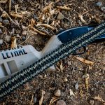 Two point paracord shotgun sling on a shotgun. Primary color woodland camo. Secondary color black. Double cobra weave.