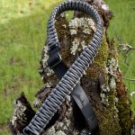 Two point paracord gun sling. Primary color grey. Secondary color black. King cobra weave. GrovTec quick disconnect swivels.