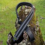 Two point paracord gun sling. Primary color grey. Secondary color black. Extra wide double cobra weave. GrovTec quick disconnect swivels.