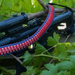 Two point paracord gun sling. King cobra "Old Glory". Red, white, and royal blue. Push button quick release swivels.