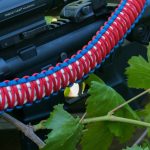 Two point paracord gun sling. King cobra "Old Glory". Red, white, and royal blue. Push button quick release swivels.