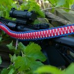 Two point paracord gun sling. King cobra "Old Glory". Red, white, and royal blue. Push button quick release swivels.