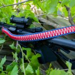 Two point paracord gun sling. King cobra "Old Glory". Red, white, and royal blue. Push button quick release swivels.