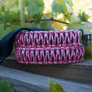 Two point paracord gun sling. Primary color pink camo. Secondary color black. King cobra weave. GrovTec quick disconnect swivels.
