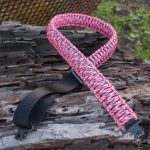 Two point paracord gun sling. Primary color pink camo. Secondary color black. King cobra weave. TOC quick disconnect swivels.