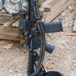 Tavor convertible single point paracord gun sling. Primary color od green. Secondary color black. Double cobra weave. Push button quick release swivels.