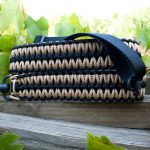 Two point paracord rifle sling. Primary color tan. Secondary color black. Extra wide double cobra weave. Push button quick release swivels.