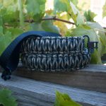 Two point paracord gun sling. Primary color woodland camo. Secondary color black. King cobra weave. GrovTec quick disconnect swivels.